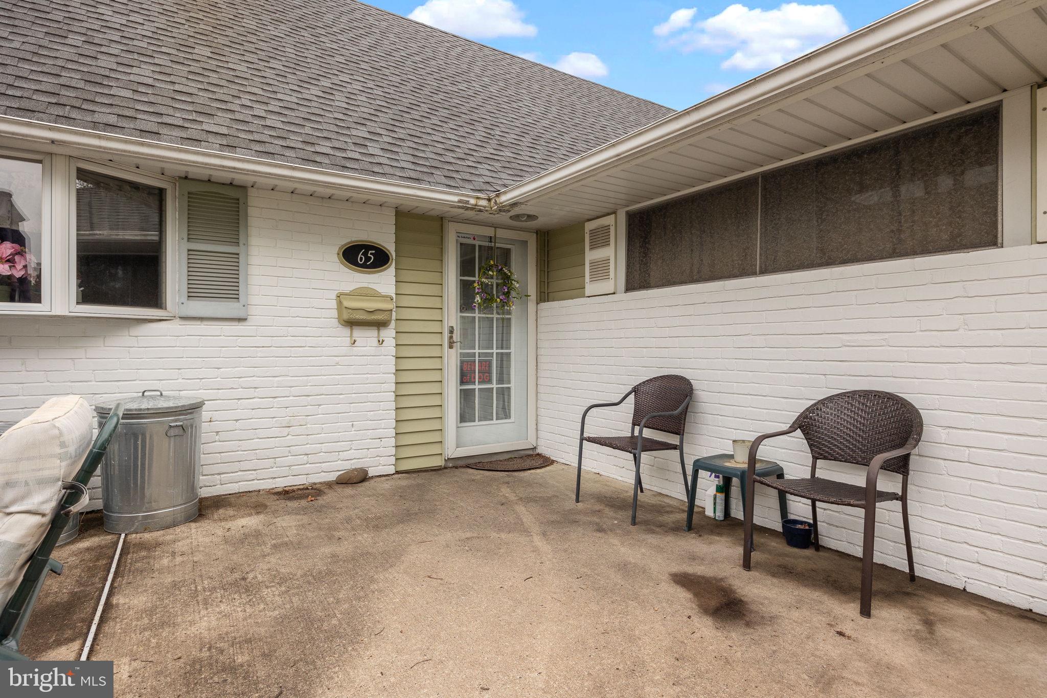 65 Silverspruce Road Levittown, PA 19056 - Photo 4 of 32 a backyard of a house with seating space