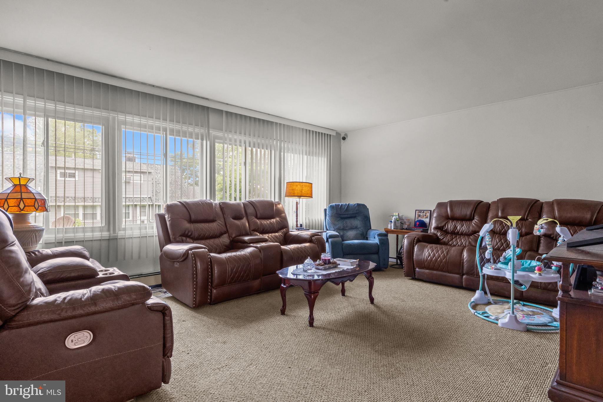 65 Silverspruce Road Levittown, PA 19056 - Photo 6 of 32 a living room with furniture and a large window