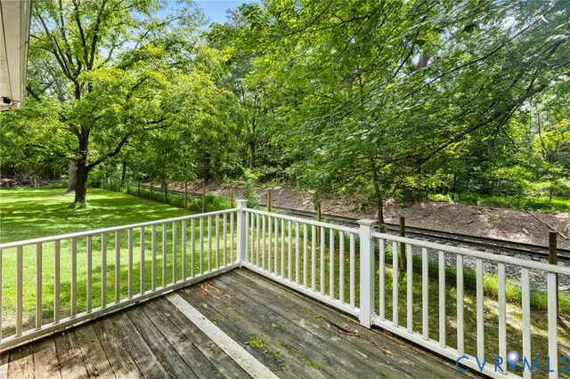 a view of balcony with wooden floor