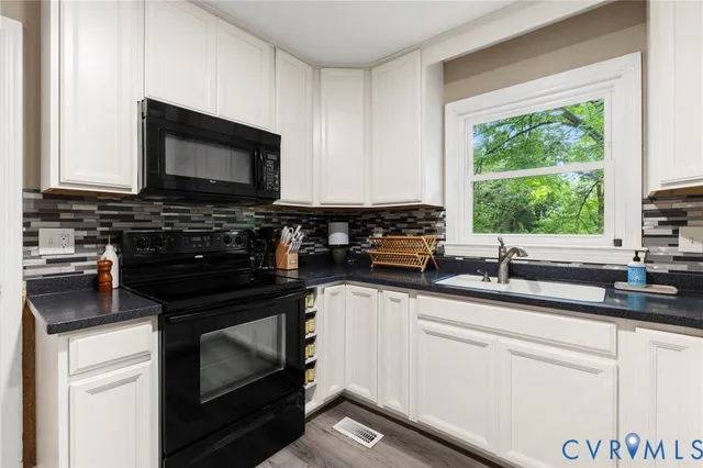 a kitchen with a stove and a microwave