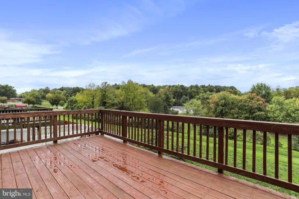 a view of balcony with wooden floor