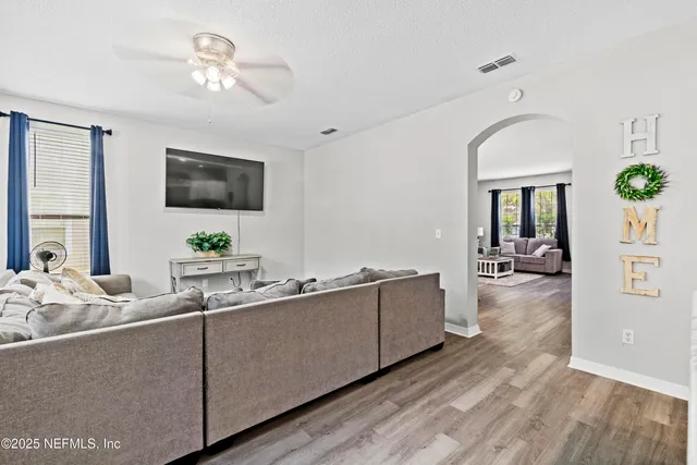a bathroom with a sink a toilet and a shower
