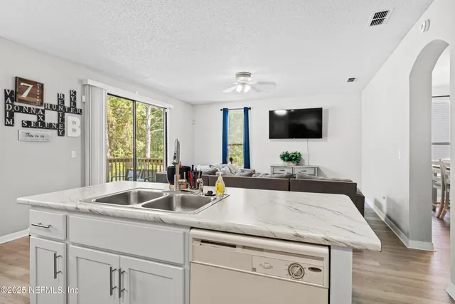 a view of a swimming pool with a patio and a garden