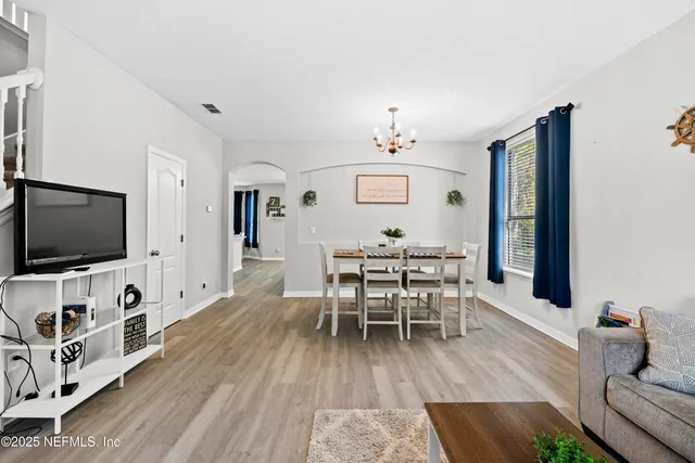a kitchen with a refrigerator and cabinets