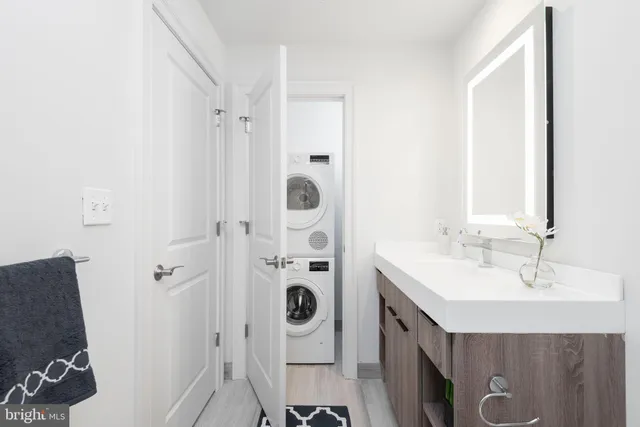 a bathroom with a mirror a sink and a mirror