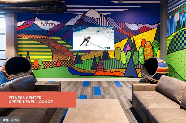 a living room with furniture and rug