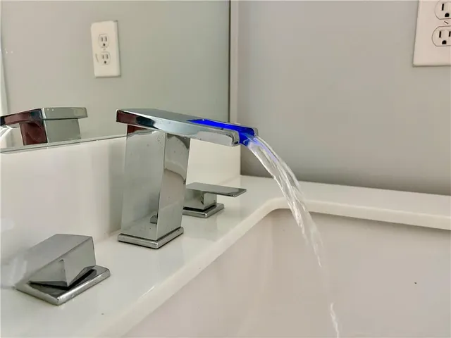 a view of storage and utility room with two washing machine