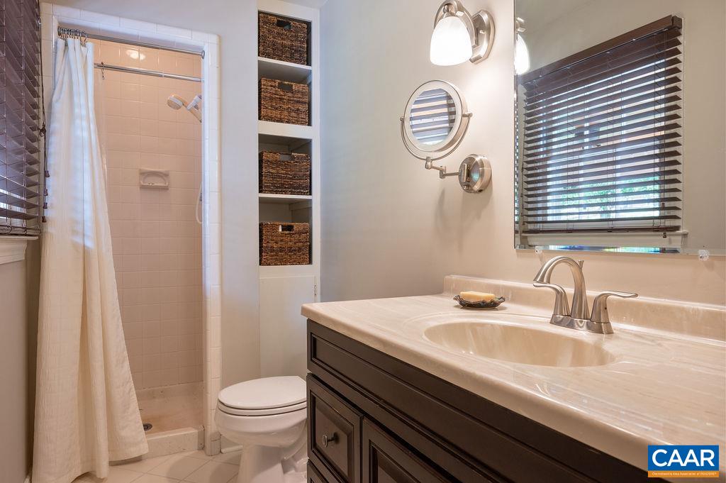 2613 Huntington Road Charlottesville, VA 22901 - Photo 16 of 53 a bathroom with a sink a toilet and a mirror