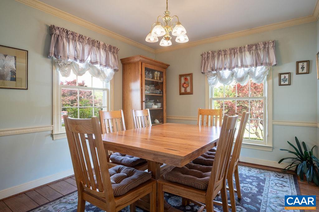 2613 Huntington Road Charlottesville, VA 22901 - Photo 8 of 53 a view of a dining room with furniture window and wooden floor