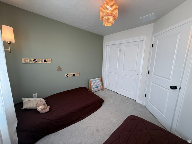 774 West 480 South American Fork, UT 84003 - Photo 66 of 76 Wall-mounted sconce lighting illuminates a room with light green painted walls