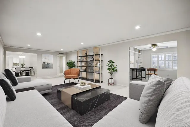 a living room with furniture and a table