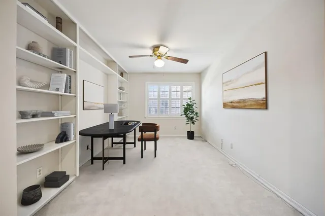 a view of a livingroom with furniture and a window