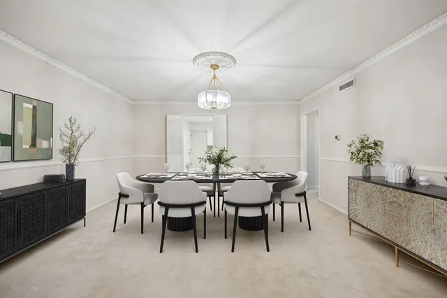 a view of a dining room with furniture and window