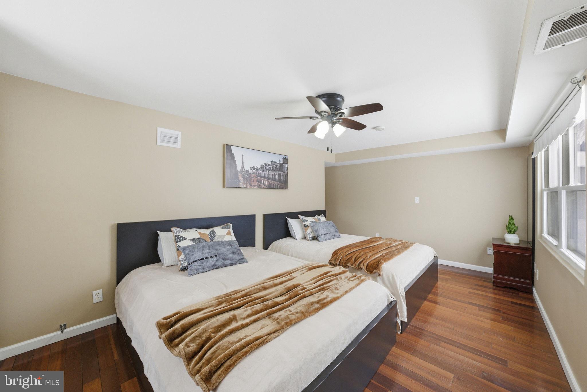 10 Magee Road Edison, NJ 08817 - Photo 16 of 45 a bedroom with a bed and wooden floor