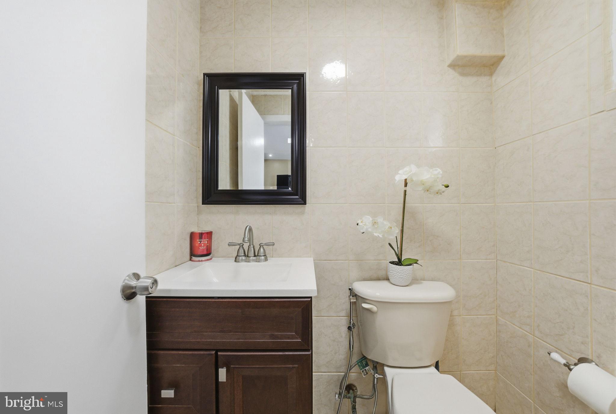 10 Magee Road Edison, NJ 08817 - Photo 18 of 45 a bathroom with a toilet sink and mirror