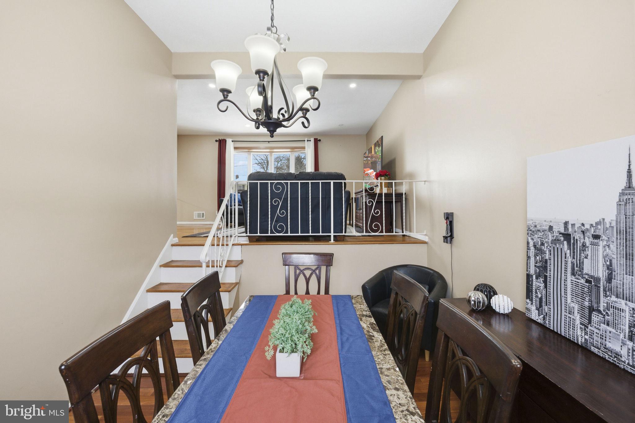 10 Magee Road Edison, NJ 08817 - Photo 19 of 45 a view of entryway and chandelier