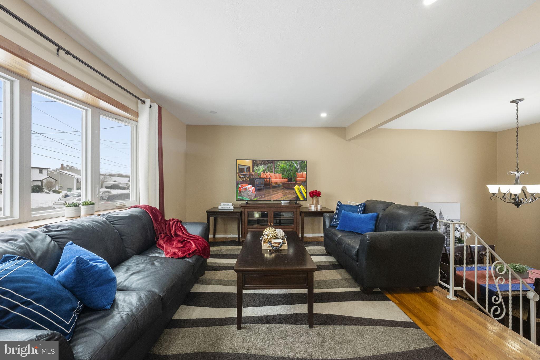 10 Magee Road Edison, NJ 08817 - Photo 20 of 45 a living room with furniture a rug and a large window