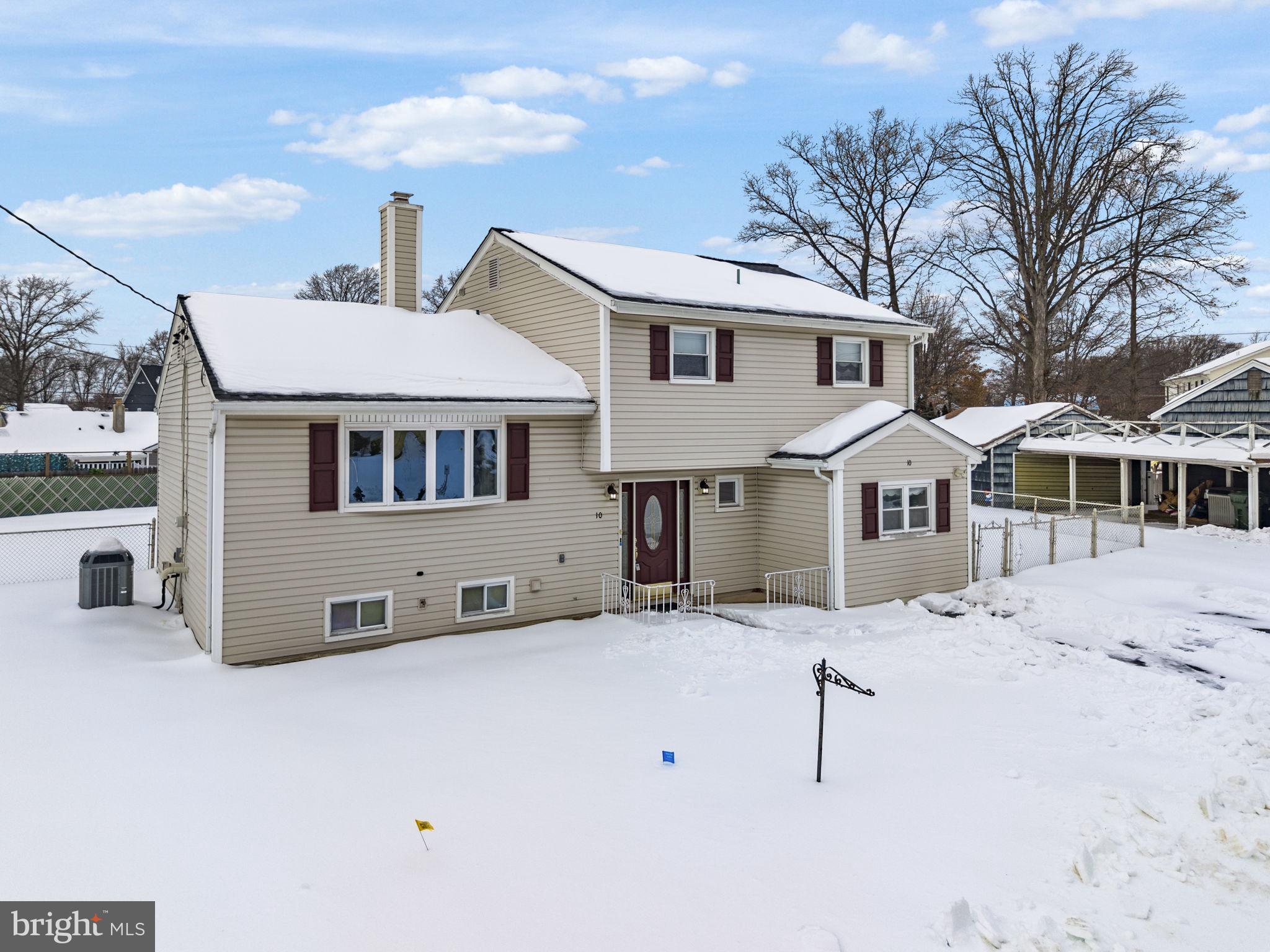 10 Magee Road Edison, NJ 08817 - Photo 2 of 45 a white house that has a tree in front of it