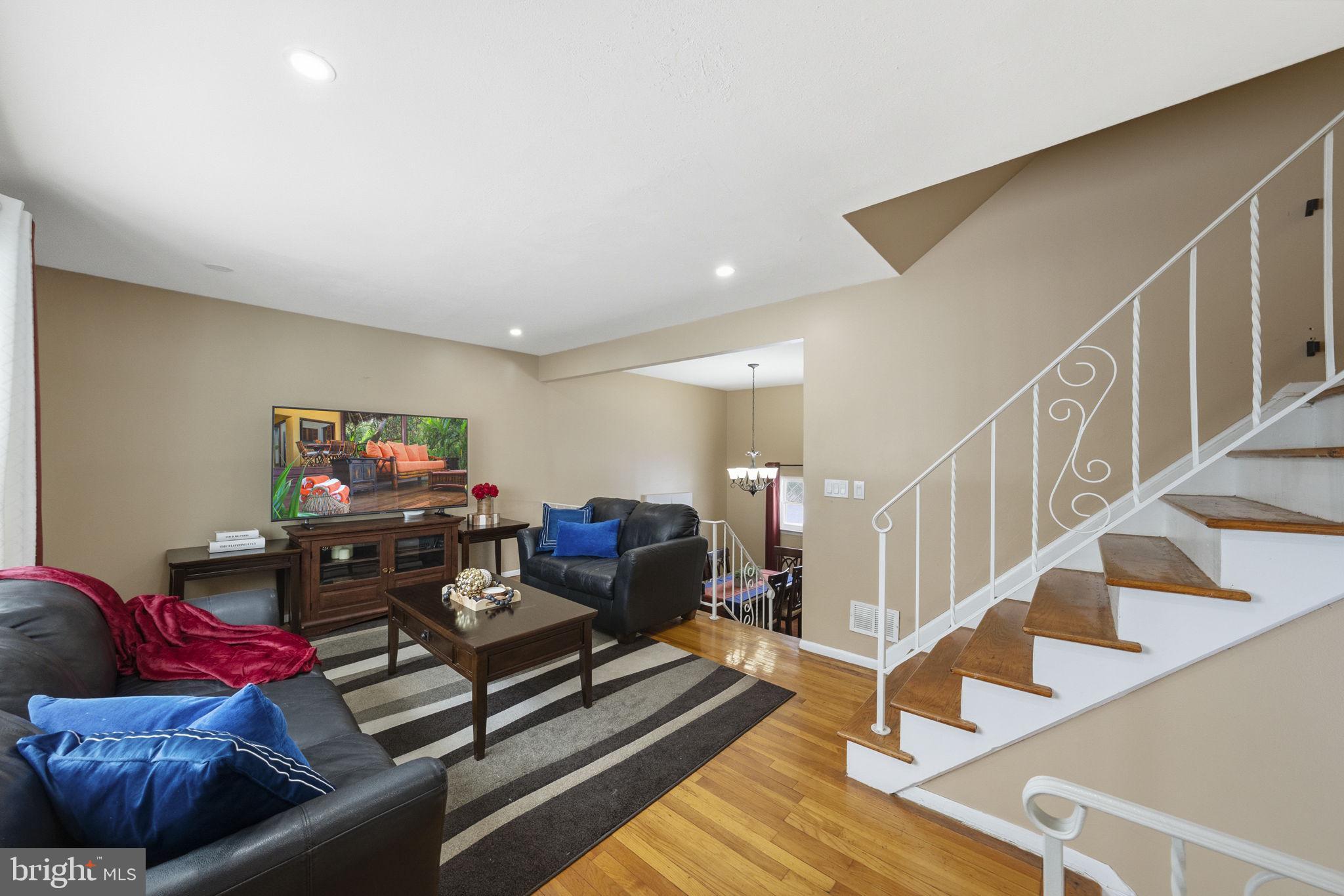 10 Magee Road Edison, NJ 08817 - Photo 21 of 45 a living room with furniture and stairs