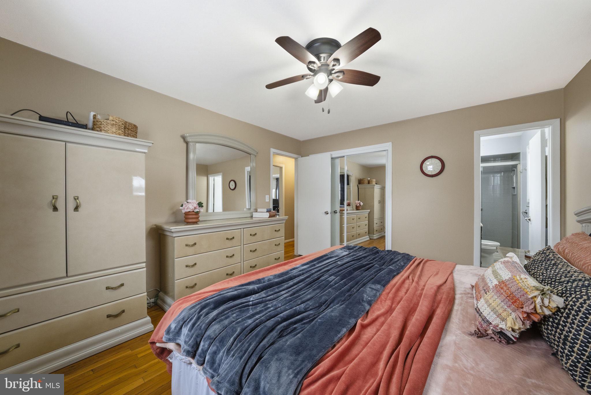 10 Magee Road Edison, NJ 08817 - Photo 26 of 45 a bedroom with a bed and a chandelier