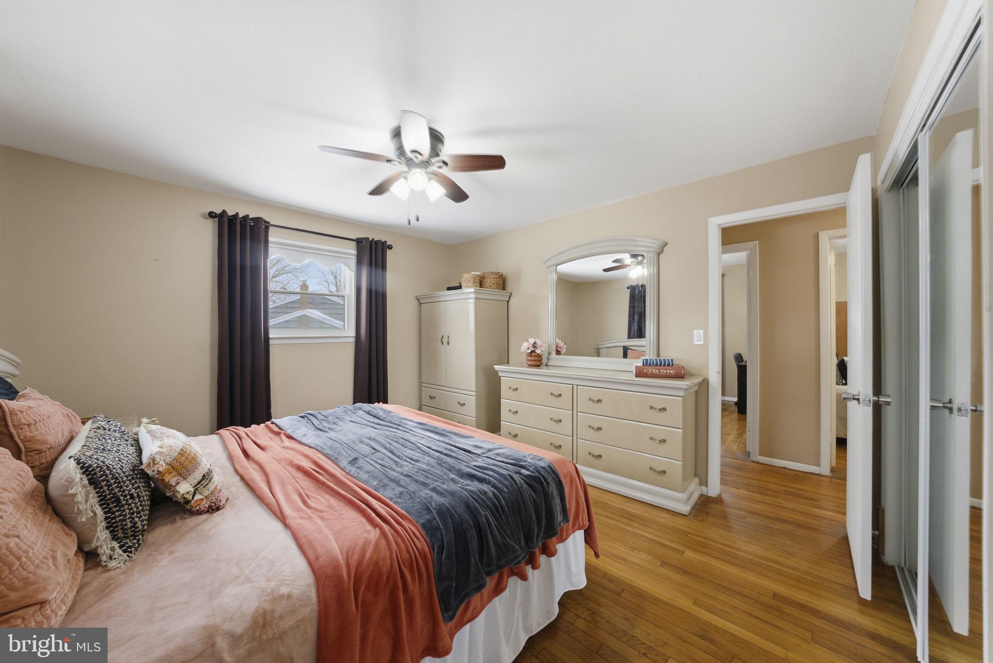 10 Magee Road Edison, NJ 08817 - Photo 27 of 45 a bedroom with a bed and wooden floor