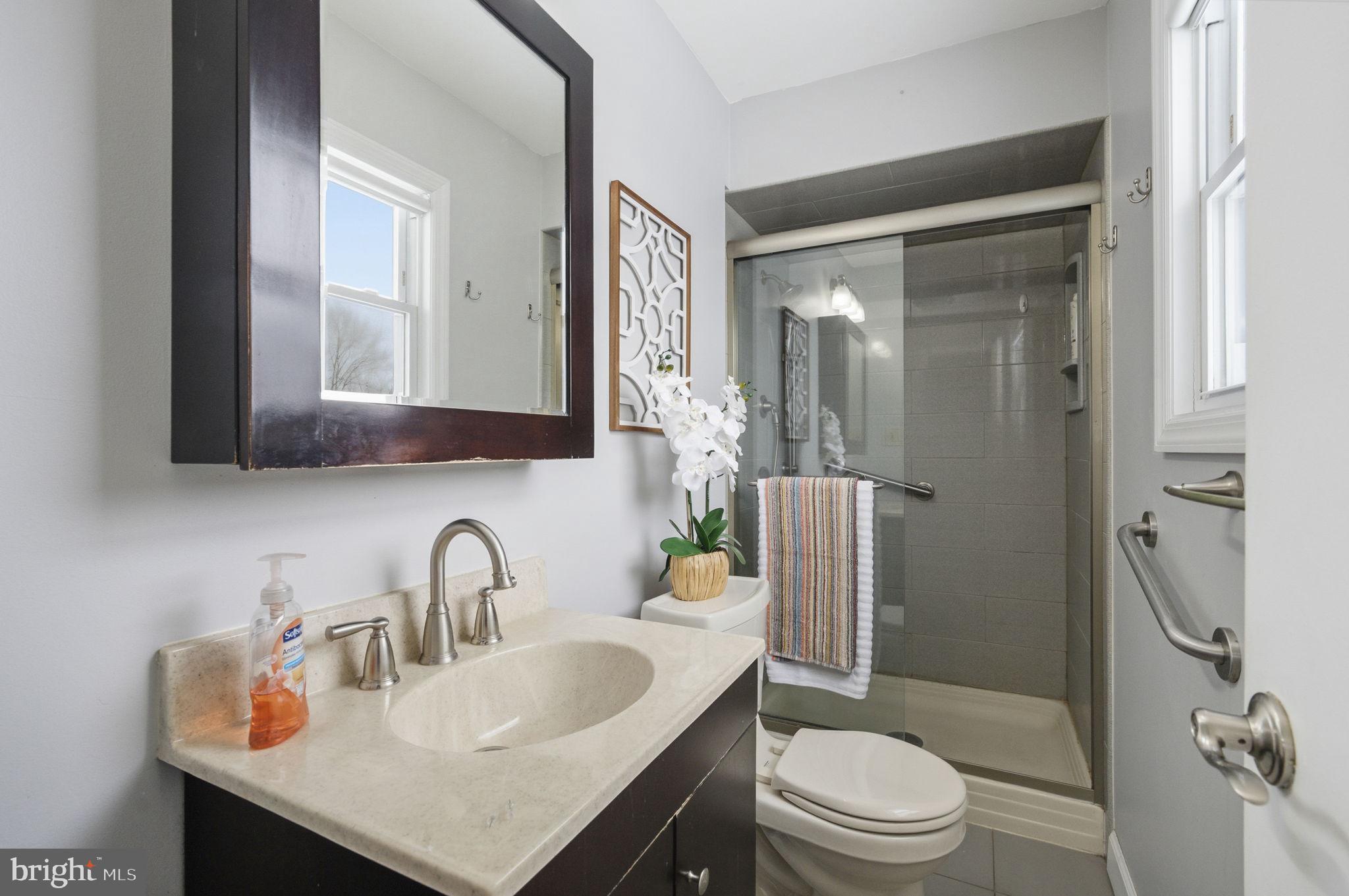 10 Magee Road Edison, NJ 08817 - Photo 29 of 45 a bathroom with a sink toilet and shower