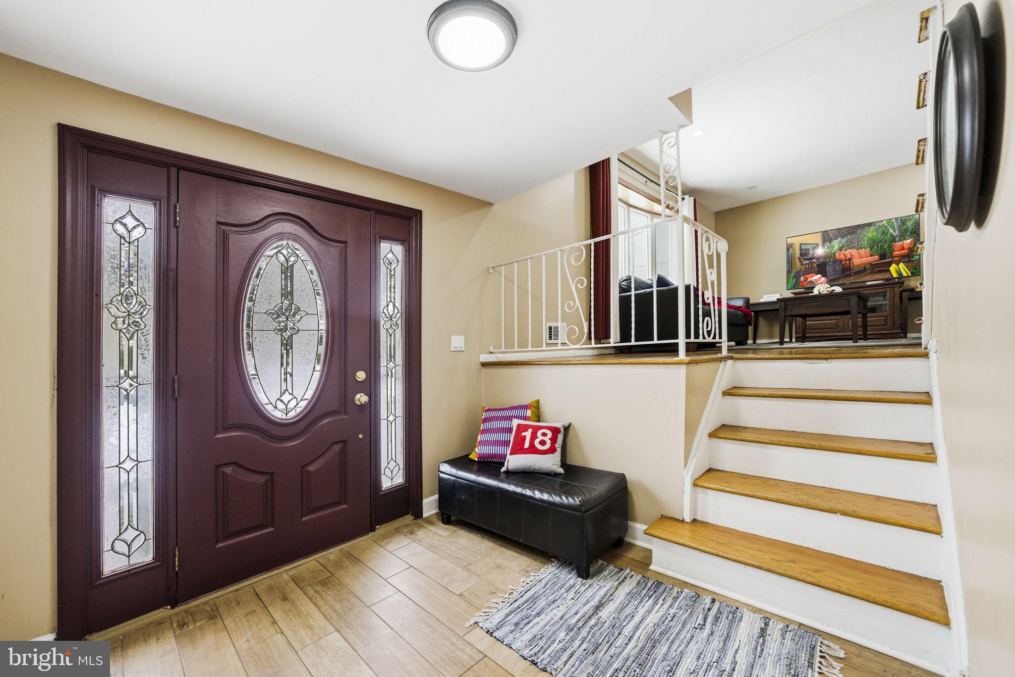 10 Magee Road Edison, NJ 08817 - Photo 3 of 45 a living room with furniture and a fireplace