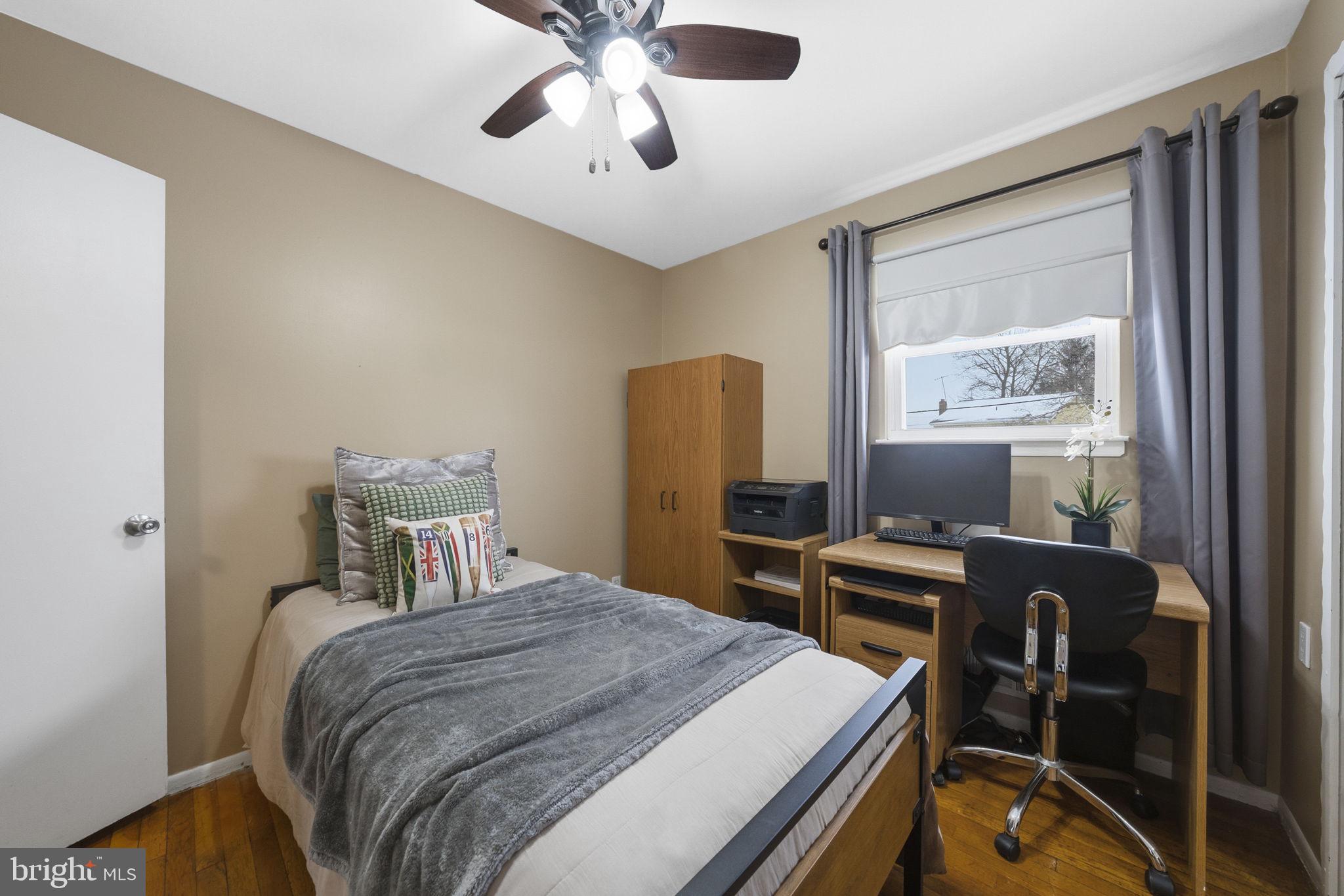 10 Magee Road Edison, NJ 08817 - Photo 31 of 45 a bedroom with a bed and a chandelier