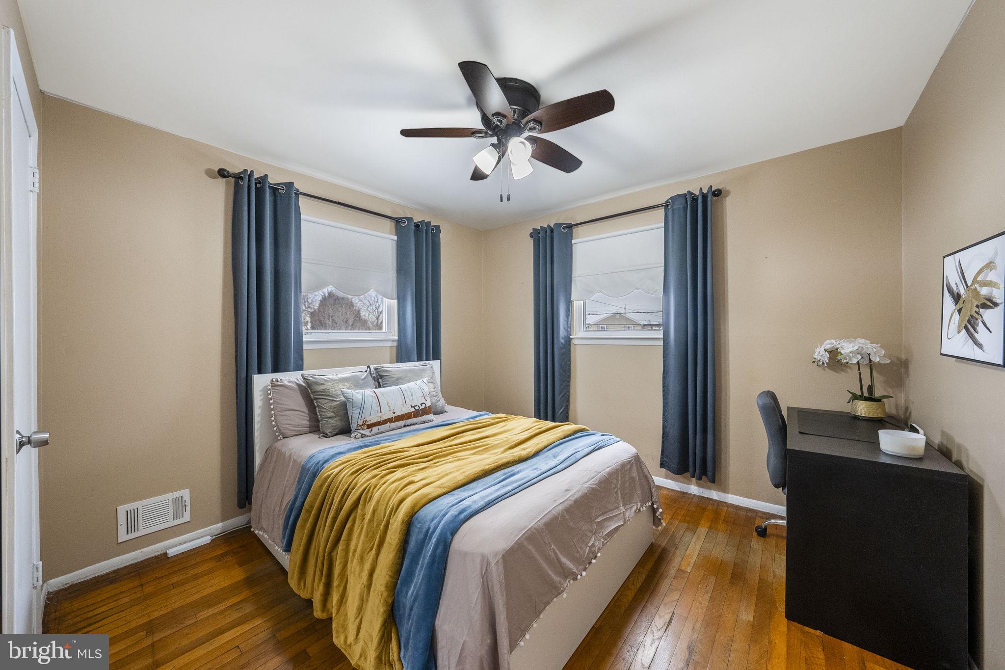 10 Magee Road Edison, NJ 08817 - Photo 32 of 45 a bedroom with a bed and wooden floor