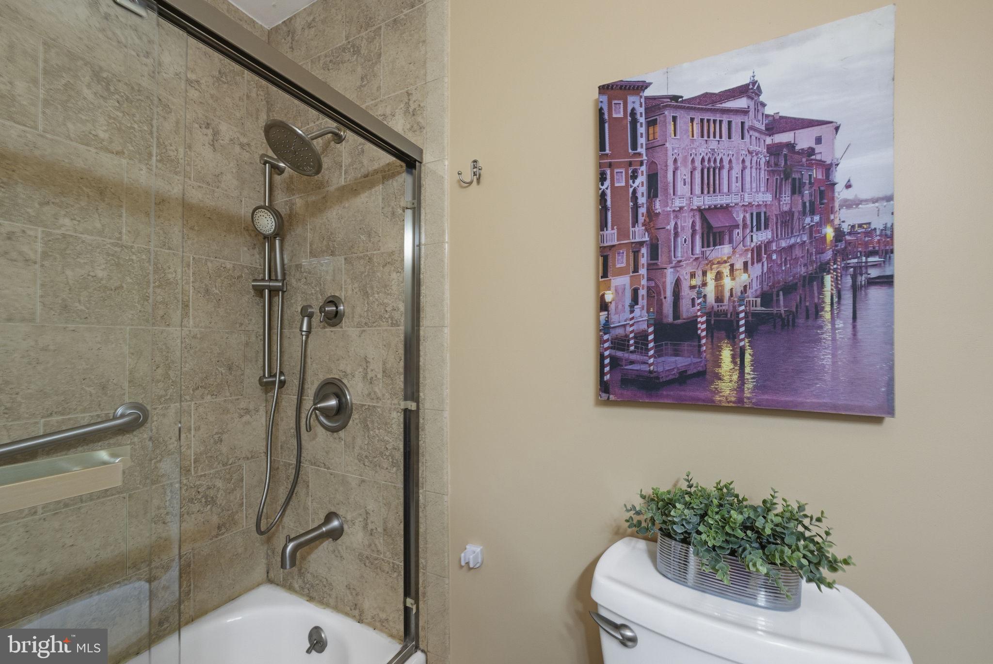10 Magee Road Edison, NJ 08817 - Photo 36 of 45 a bathroom with a bathtub shower sink mirror and toilet
