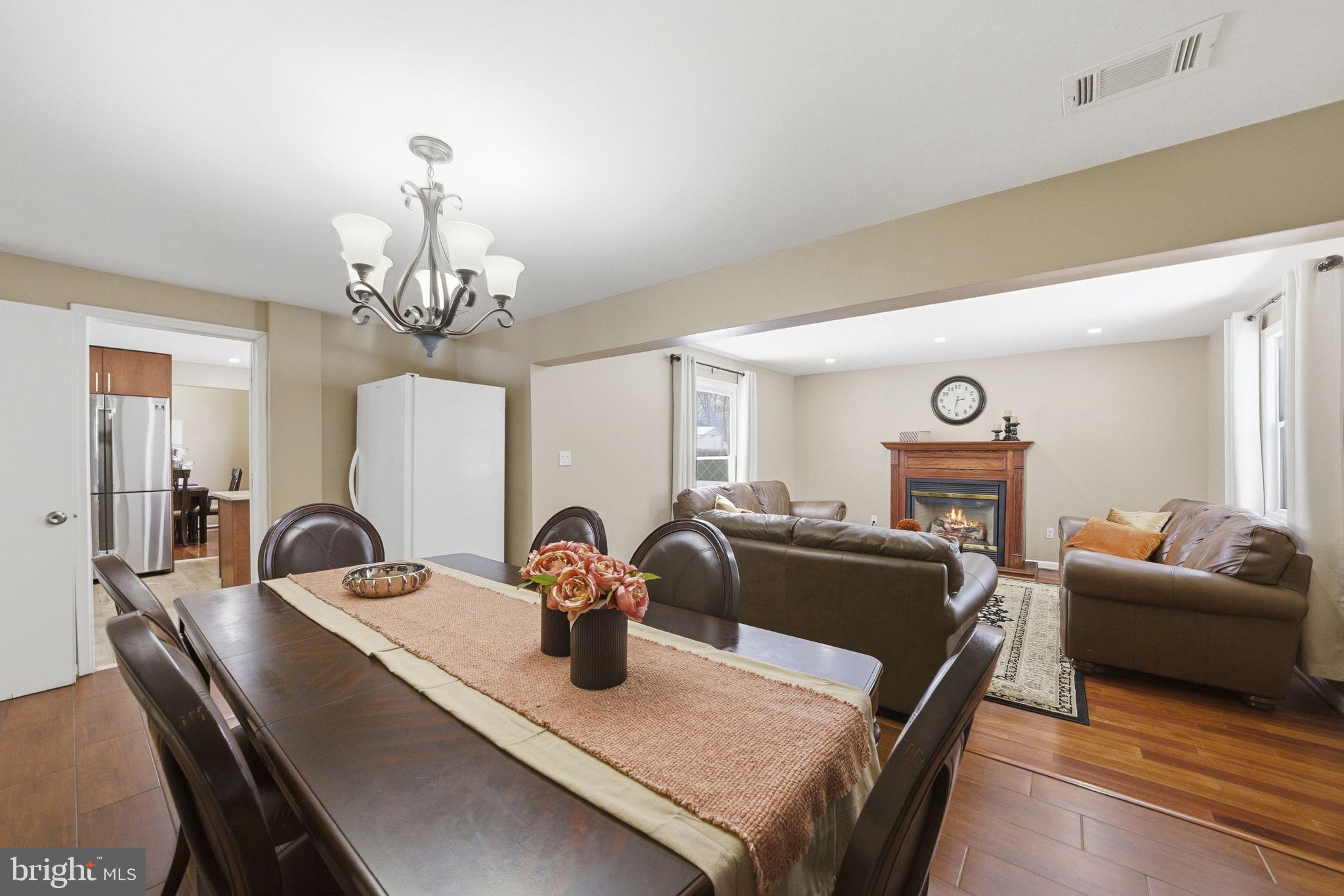 10 Magee Road Edison, NJ 08817 - Photo 8 of 45 a view of a dining room with furniture and chandelier