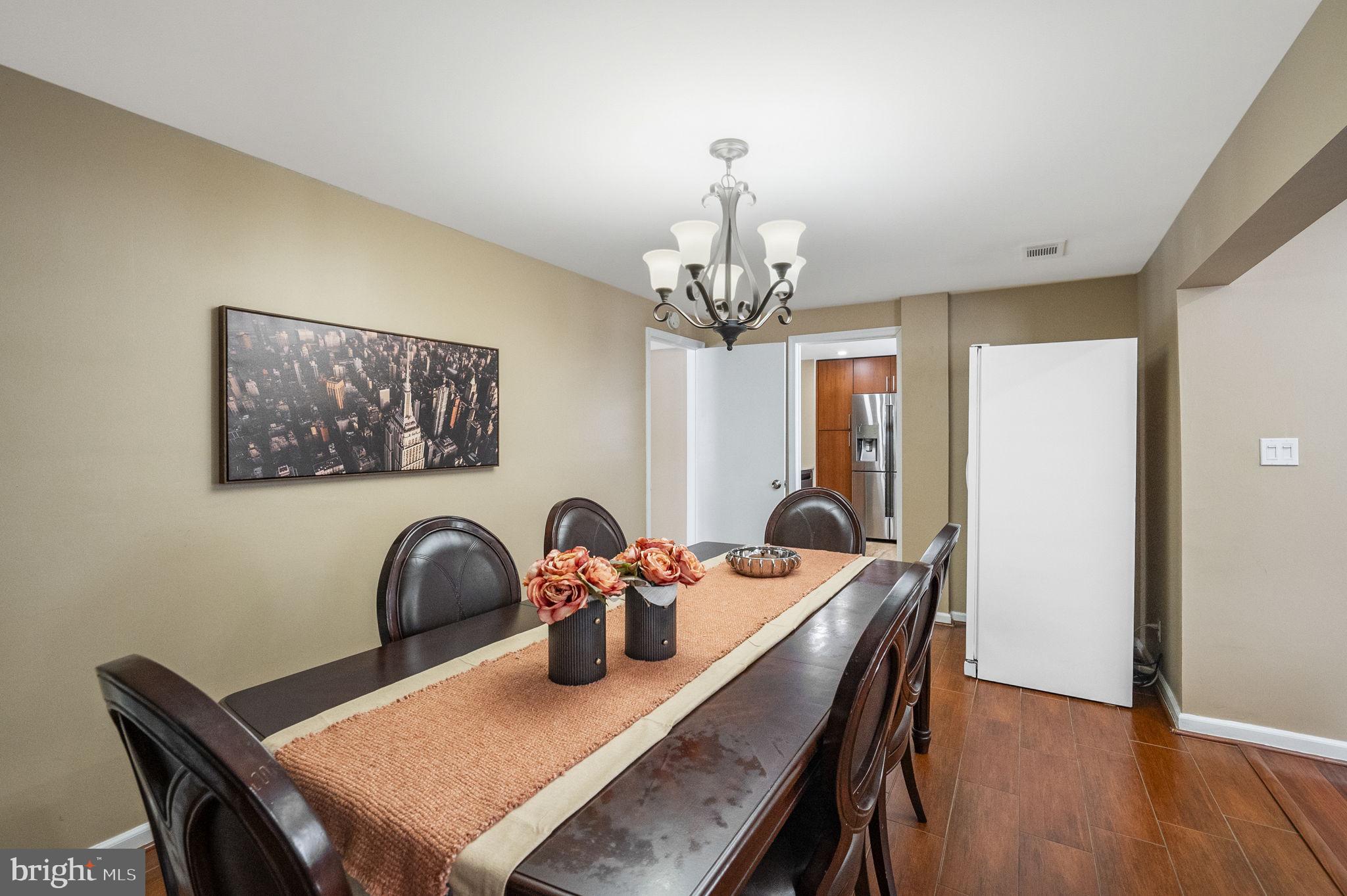 10 Magee Road Edison, NJ 08817 - Photo 9 of 45 a dining room with furniture and wooden floor