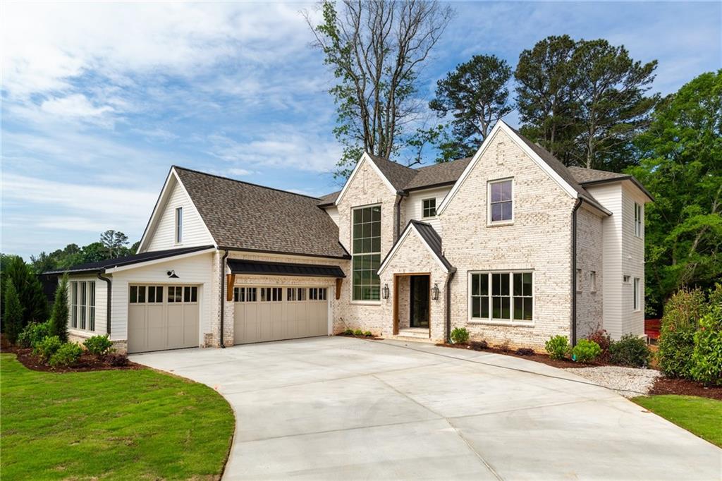 10908 Woodstock Road Roswell, GA 30075 - Photo 1 of 26 front view of a house with a yard
