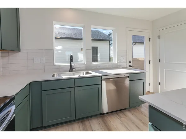 a bathroom with a sink a mirror and vanity