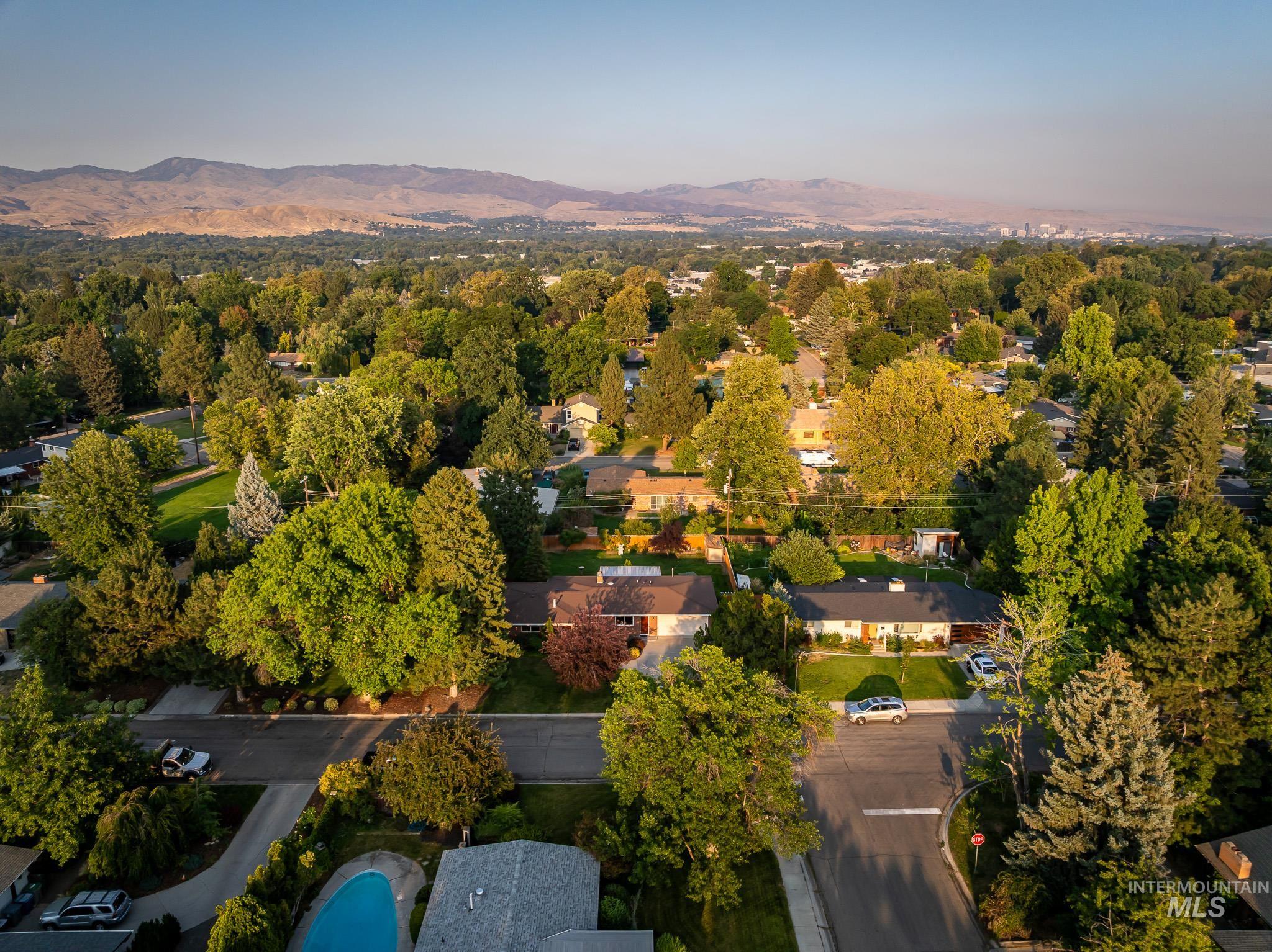 3706 West Clement Road Boise, ID 83704 - Photo 2 of 36 Expansive neighborhood featuring mature tree canopy, residential streets, and distant mountain backdrop