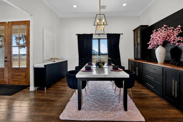 a view of a dining room with furniture and window