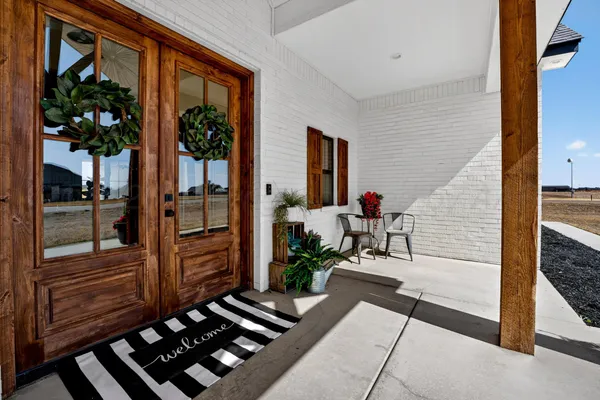a view of a porch with wooden floor