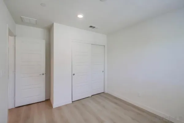 a bathroom with a toilet sink and vanity