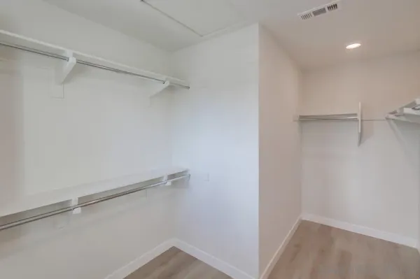a view of an empty walk in closet