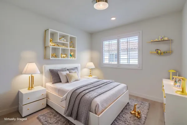 a bedroom with bed and a night stand