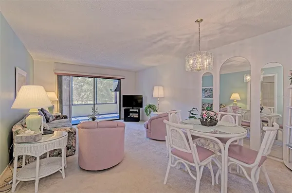 a living room with furniture and a lamp