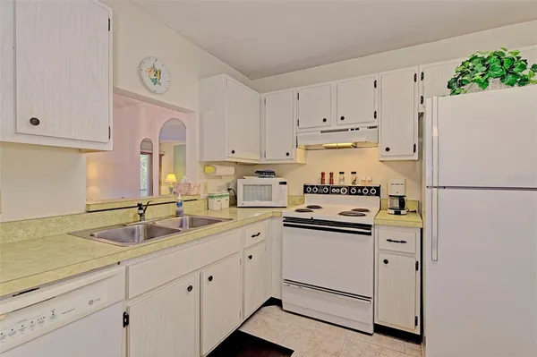 a bathroom with a table and chair