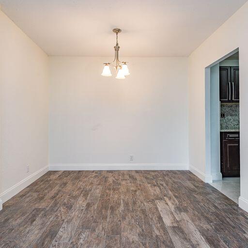 250 Northeast 20th Street, Unit 3210 Boca Raton, FL 33431 - Photo 12 of 26 wooden floor in an empty room with a window