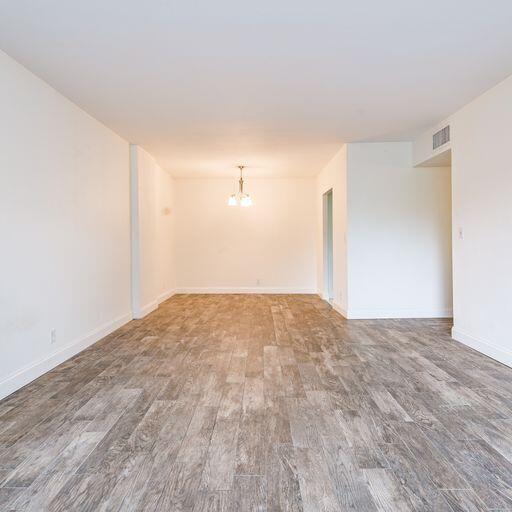 250 Northeast 20th Street, Unit 3210 Boca Raton, FL 33431 - Photo 13 of 26 a view of empty room with wooden floor