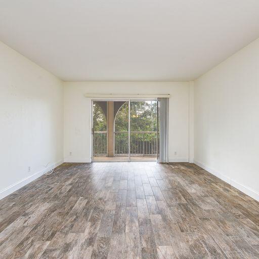 250 Northeast 20th Street, Unit 3210 Boca Raton, FL 33431 - Photo 14 of 26 wooden floor in an empty room with a window