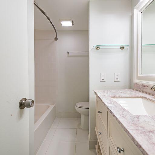 250 Northeast 20th Street, Unit 3210 Boca Raton, FL 33431 - Photo 18 of 26 a bathroom with a granite countertop sink toilet and shower