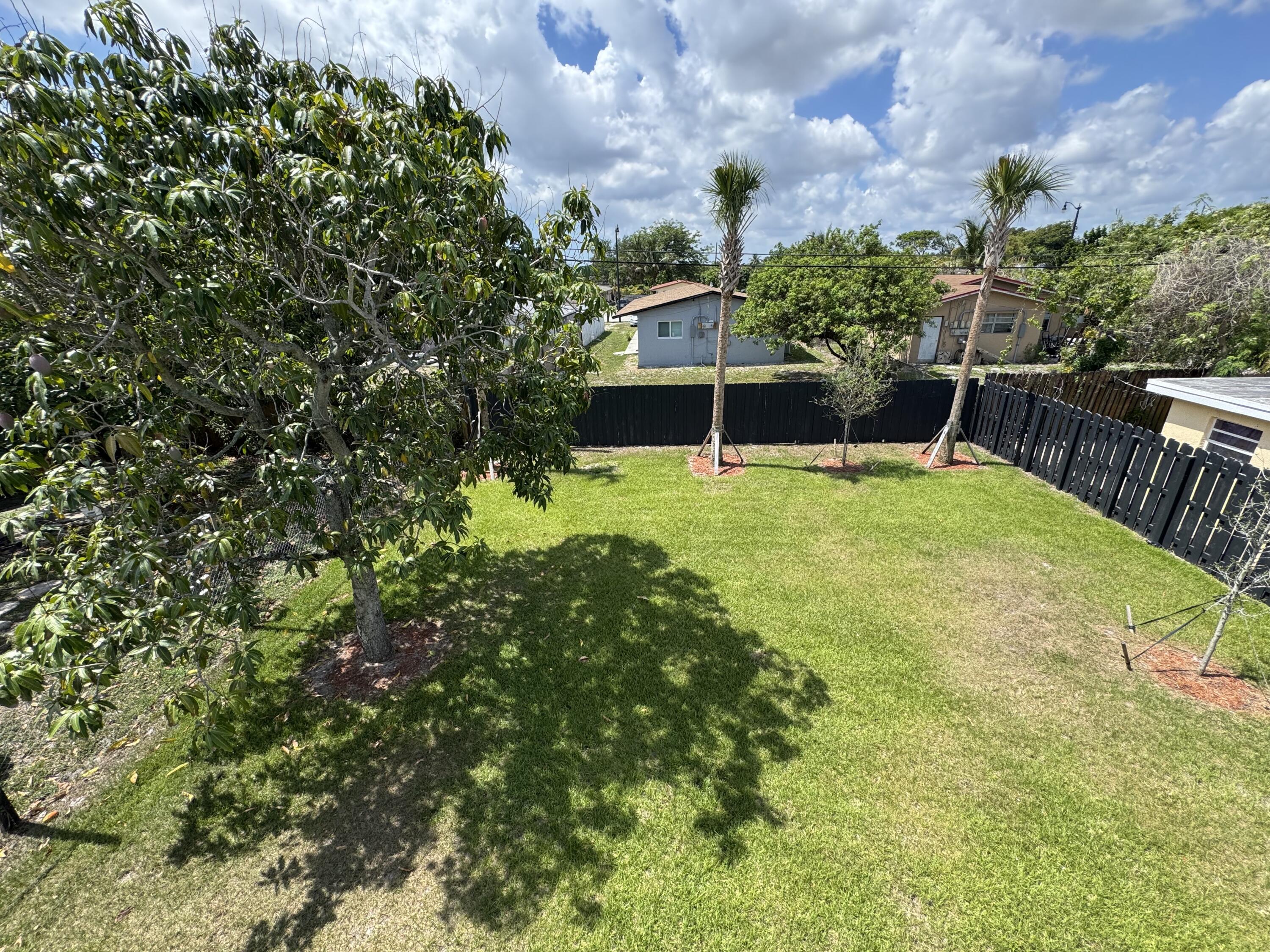400 Northeast 30th Street, Unit 2 Pompano Beach, FL 33064 - Photo 10 of 22 a view of a backyard with swimming pool