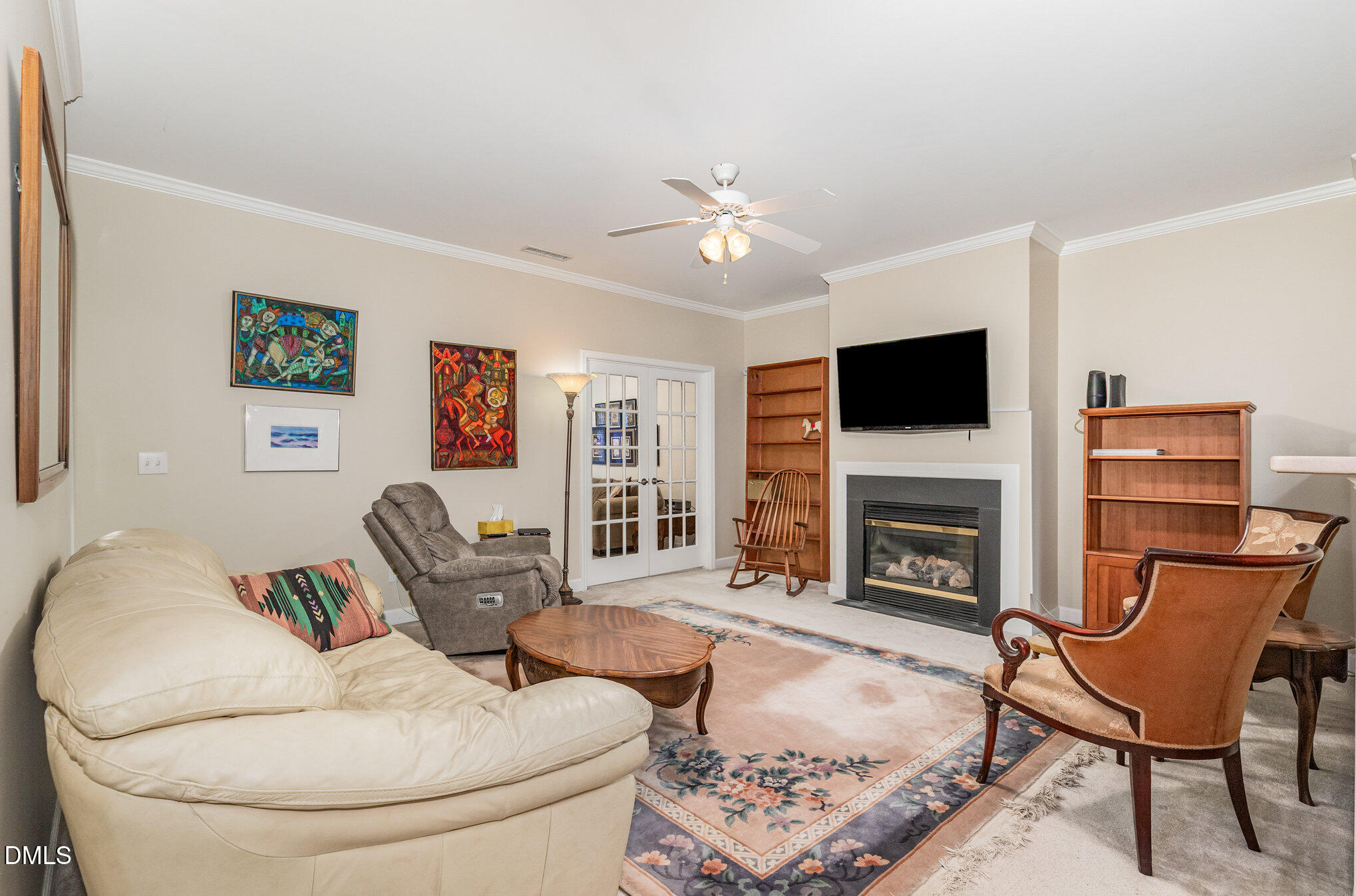2541 Forest Shadows Lane Raleigh, NC 27614 - Photo 8 of 23 a living room with furniture a flat screen tv and a fireplace