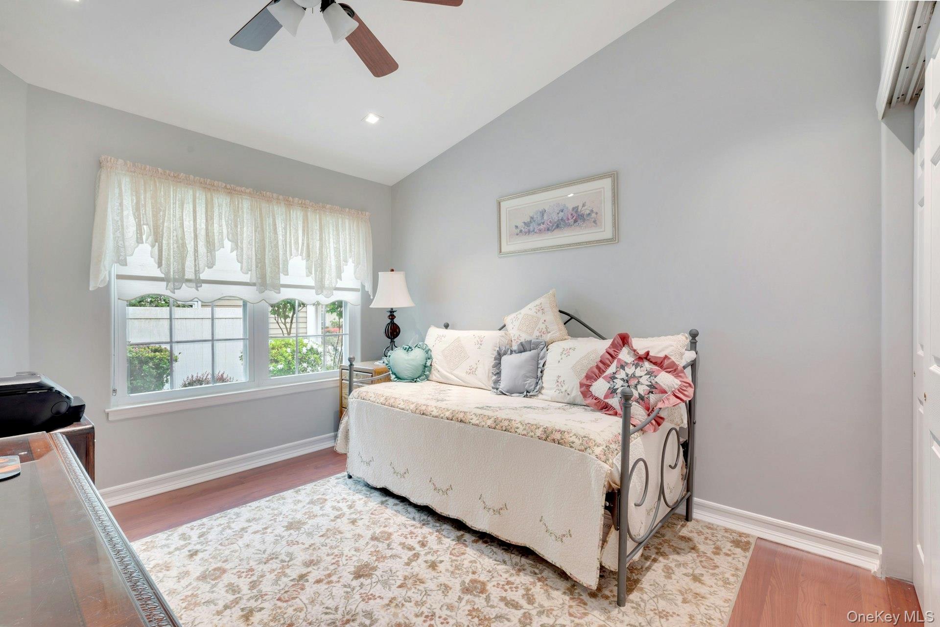 104 Glen Drive Ridge, NY 11961 - Photo 17 of 25 a living room with furniture and a window
