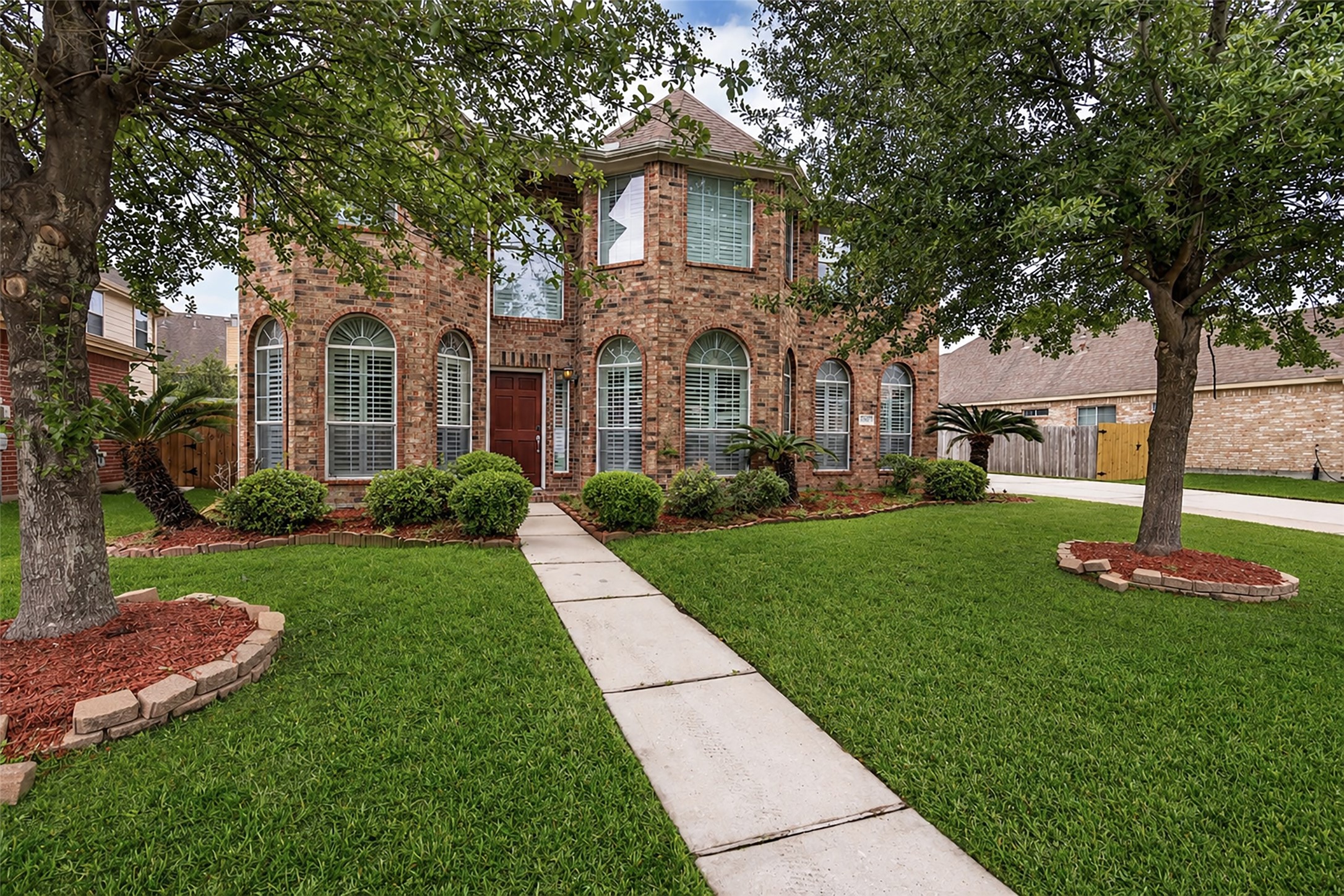 6807 Chapelfield Lane Houston, TX 77049 - Photo 1 of 42 a front view of a house with a yard